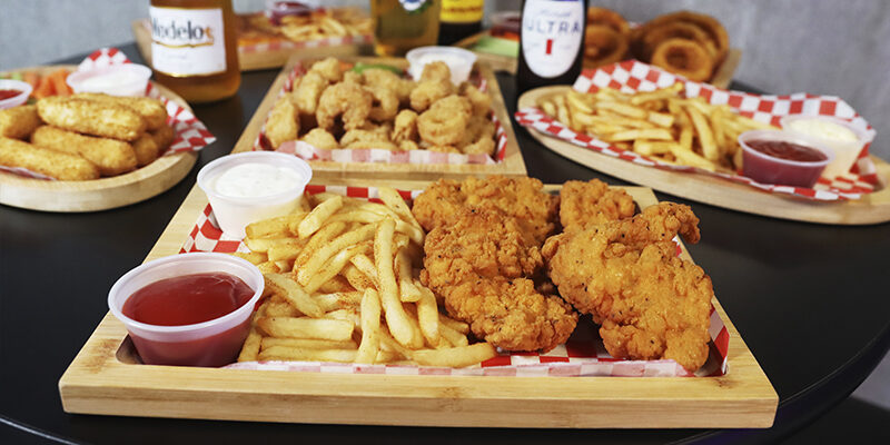 Boneless with fries, cheese sticks with cups of sauce